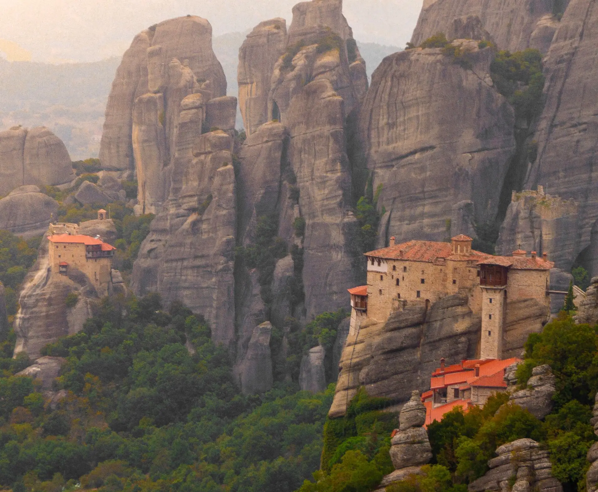 Meteora monasteries on the rocks at sunset